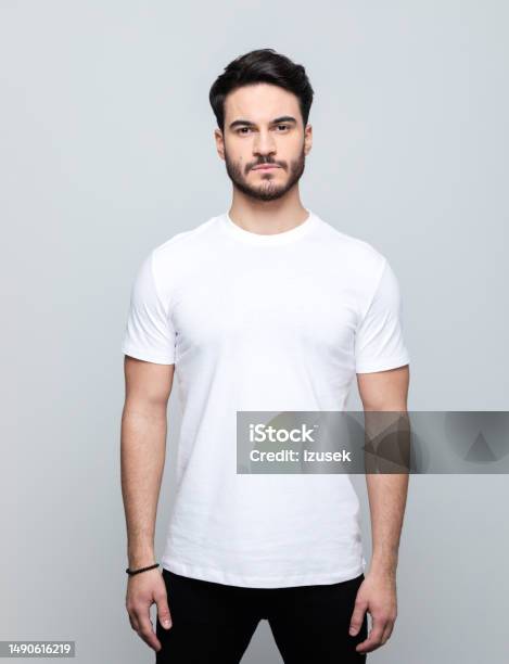 Portrait Of Handsome Young Man Stock Photo - Download Image Now - Men, T-Shirt, White Color