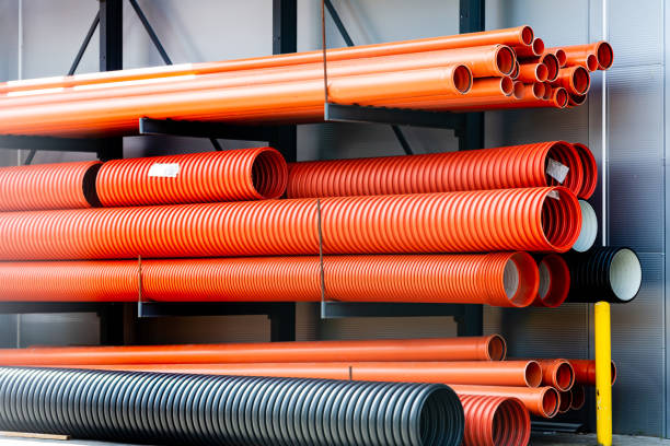 istock Building material ventilation pipes.Plastic pipes for waste sewerage.Drainage and sewerage. Modern technologies of building houses and ennobling the territory.Corrugated pipes are on the street. 1490616703