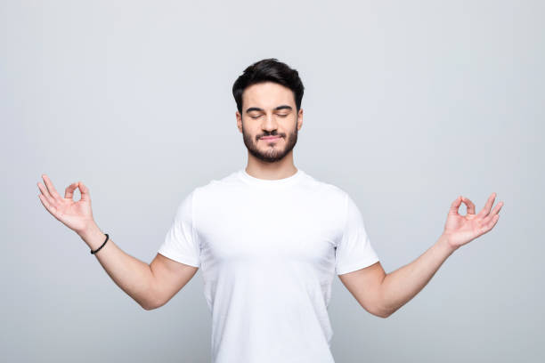 Portrait of young man meditating