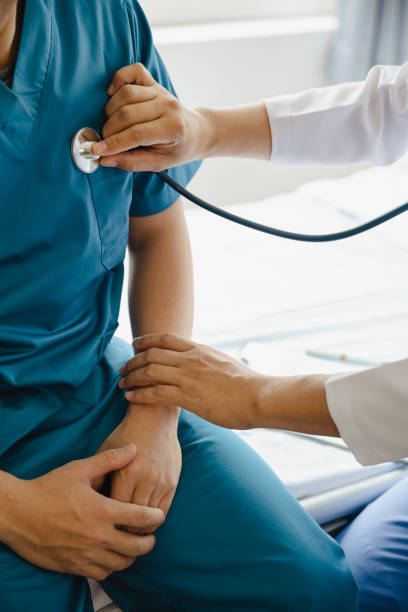 istock Physiotherapist working with patients in clinic, 1490618859