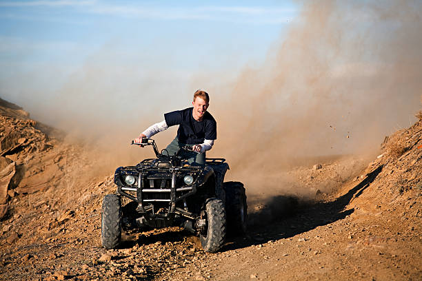 istock teenager riding quad four wheeler 149061936