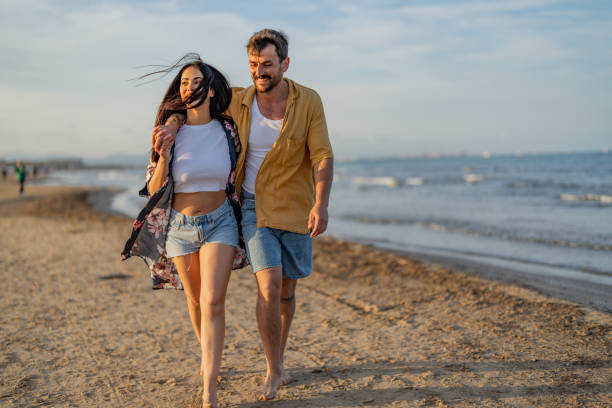 istock Young couple spending time together at the beach 1490620566