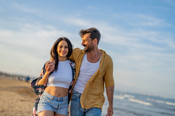 istock Young couple bonding at the beach 1490620587