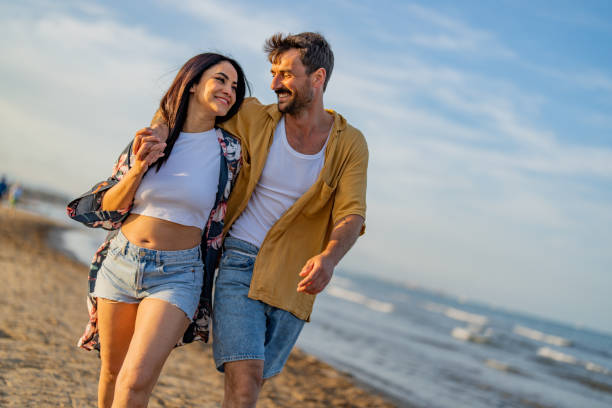 istock Couple enjoying a day at the beach 1490620629