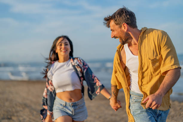 istock Lovely couple in love having fun on the beach. 1490620681