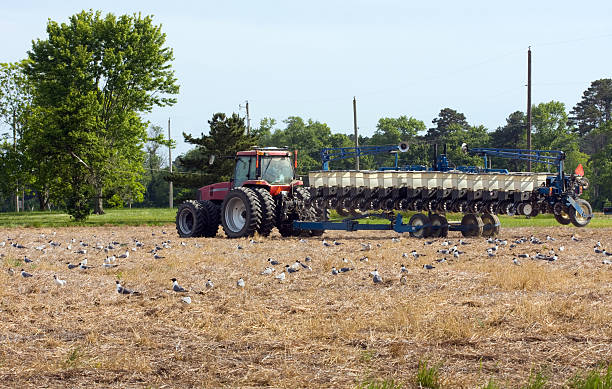 Farm Tractor and Planter stock photo