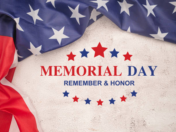 istock American flag with the text Memorial day, remember and honor on a cement floor. 1490621660