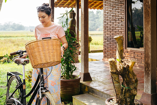 woman ready to go by bicycle at home