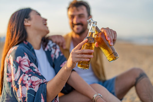 Young attractive girl toasting with her boyfriend