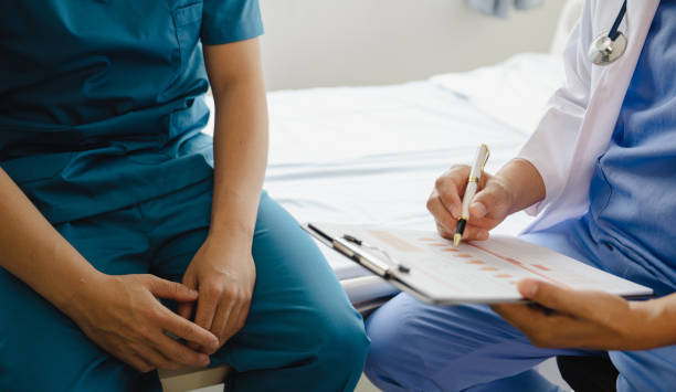istock Physiotherapist working with patients in clinic, 1490624038