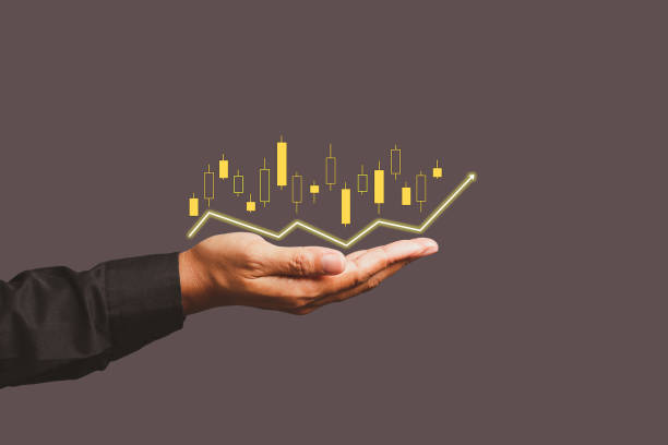 istock The stock financial graph and digital increasing line graph on the palm. 1490624241