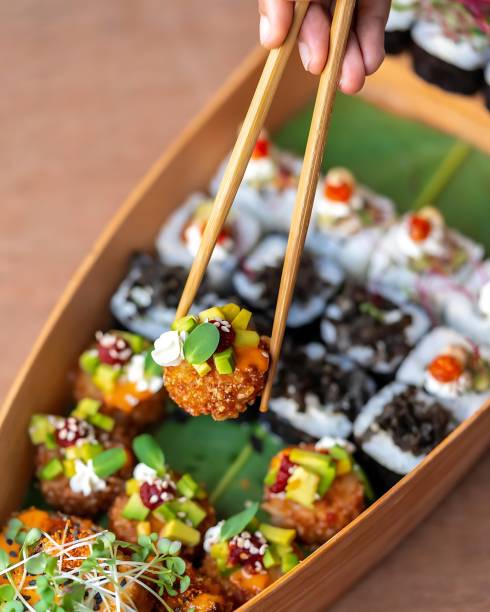 istock tasty sushi roll with salmon from set at table, closeup combo 1490624820