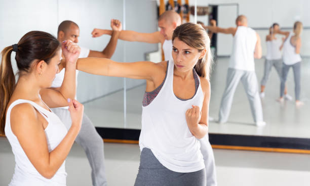 istock Two woman is training on self defense course in gym 1490626034
