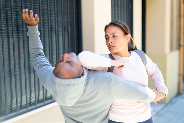 istock Hispanic girl applying self defence moves to protect from robbery 1490626087