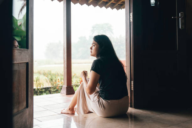 istock asian woman sitting on patio 1490626428