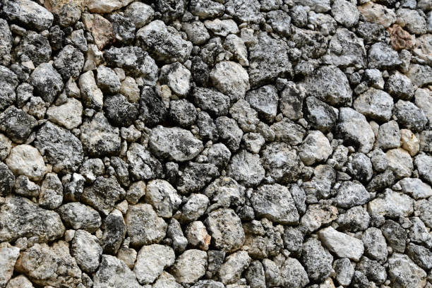 Chalan Kanoa, Saipan, Commonwealth of the Northern Mariana Islands (CMNI): exterior wall made of coralline rock masonry, irregular blocks of marine limestone - backgrounds.