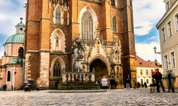 Photo of Tourists walking by Center historical streets of Wroclaw