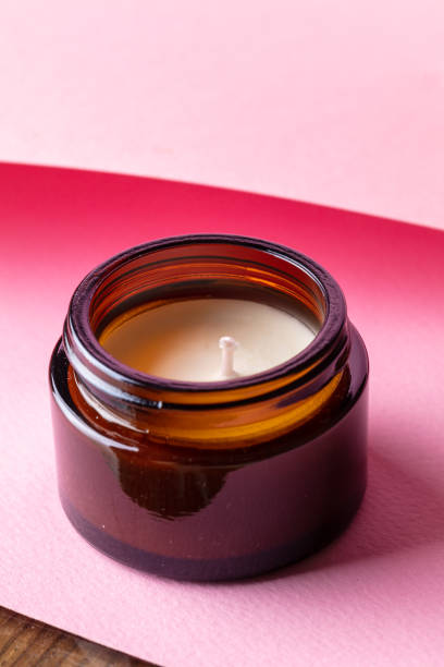 istock Aroma candle on pink background. 1490631109