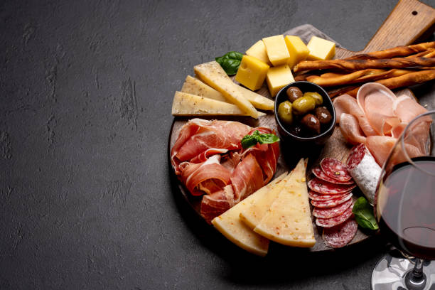 istock Antipasto board with various meat and cheese snacks 1490631292