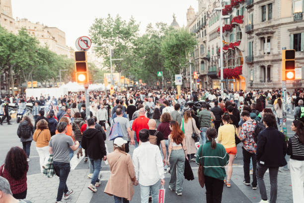 istock Crowd of people walking at zebra crossing. 1490631499