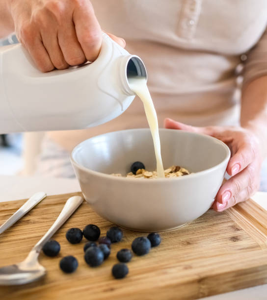 istock Girl preparing morning breakfast with oatmeal 1490633526