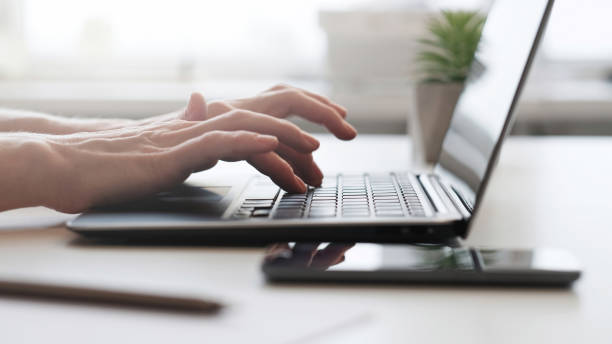 istock Online work digital business hands typing laptop 1490634566