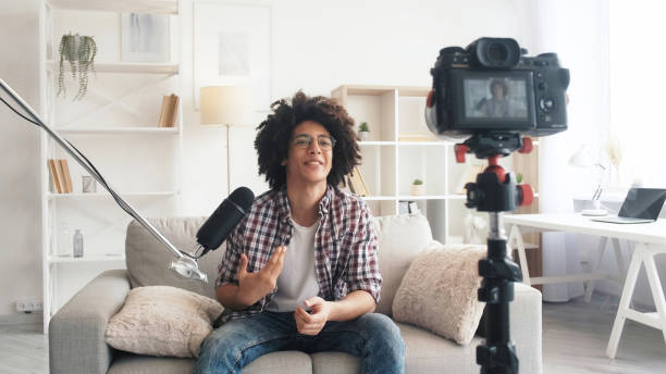 istock Vlogger lifestyle stream broadcast guy camera home 1490634617