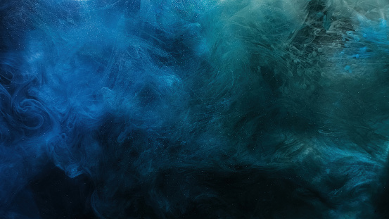 Color mist. Ink water. Haze texture. Fantasy night sky. Blue green shiny glitter steam cloud blend on dark black abstract art background.