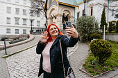 Young Woman Having A Video Call In Front Of The Church Of St Nicholas The Miracle-Maker In Sofia