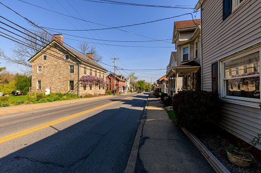 Main Street in Stockertown borough, view on welthy two story houses with yards in small town in Northampton County, Pennsylvania. Lehigh Valley, Poconos USA