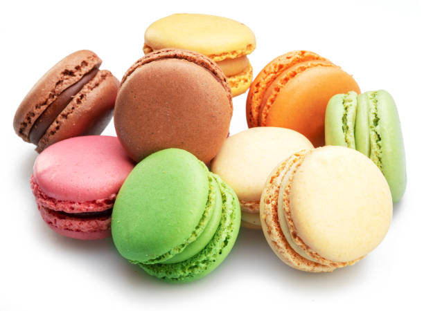 istock Colorful french macaroon cookies isolated on white background. 1490642933