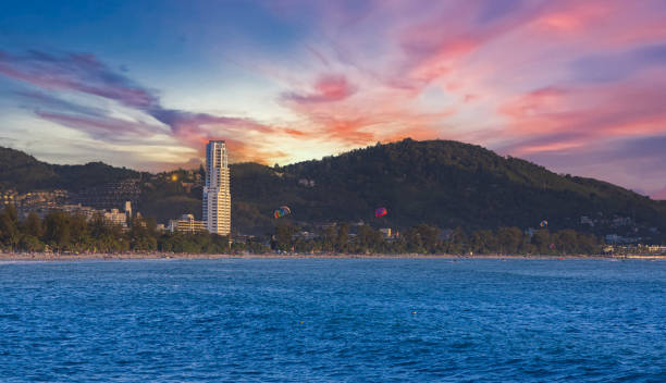 istock Patong Beach Phuket Thailand nice white sandy beach clear blue and turquoise waters and lovely blue skies with Palms tree sunset sunrise 1490645605