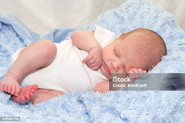 Newborn Baby In White Sleeping On A Blue Blanket Stock Photo - Download Image Now - Baby - Human Age, Beautiful People, Beauty