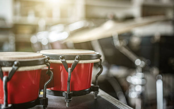 Red bongos drums in recording studio Red bongos drums in recording studio for hard beat perfomance. Professional musical instrument for rock concerts antelope bongo stock pictures, royalty-free photos & images