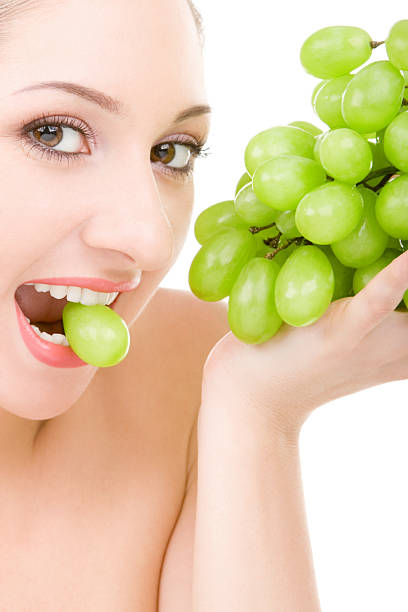 istock pretty woman with green grape 149065034