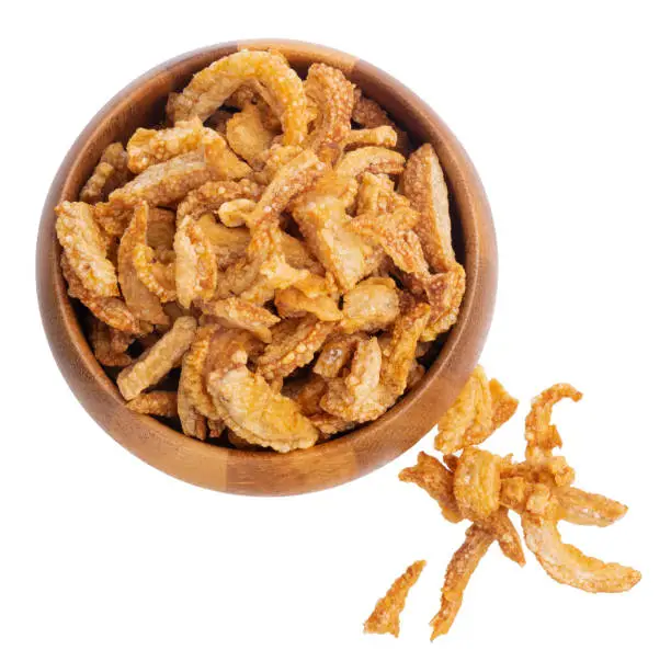 Photo of Fried crispy Pork Skins in Wooden bowl isolated on transparent background png.