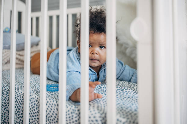 istock Baby boy lying in a crib 1490654592