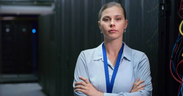 istock Portrait, woman and technician in a server room for cloud computing or cyber security at night. Tech, face of it engineer person working on database for maintenance or networking in data center 1490657569
