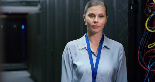 istock Portrait, woman and technician in a server room for cloud computing or cyber security at night. Tech, face of it engineer person working on database for maintenance or networking in data center 1490657613