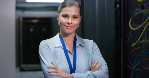 istock Portrait, woman and technician in a server room for cloud computing or cyber security at night. Tech, face of it engineer person working on database for maintenance or networking in data center 1490657639