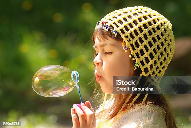 Little Girl With Soap Bubbles Stock Photo - Download Image Now - Beauty, Blowing, Bubble Wand