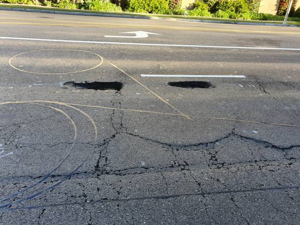 istock The road's surface is uneven and deteriorated. may put the driver in danger. 1490657804