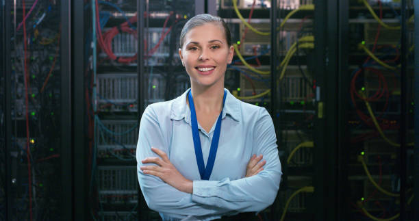 istock Portrait, woman and technician in a server room for cloud computing or cyber security at night. Tech, face of it engineer person working on database for maintenance or networking in data center 1490657892
