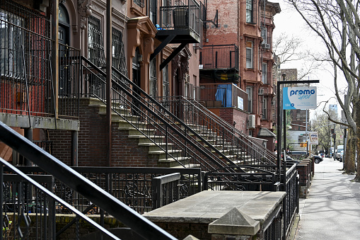 New York, USA, April 11, 2023 - Typical row houses ( Old Brownstones) near Kea St in South Williamsburg, a neighborhood with large Hasidic population.