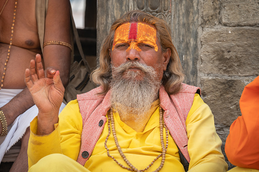 Kathmandu, Nepal - April-22-2023 : A yogi is a practitioner of Yoga, including a sannyasin or practitioner of meditation in Indian religions.