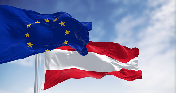 Austria and European Union flags waving together on a clear day. Democracy and politics. European country. 3d illustration render. Fluttering fabric