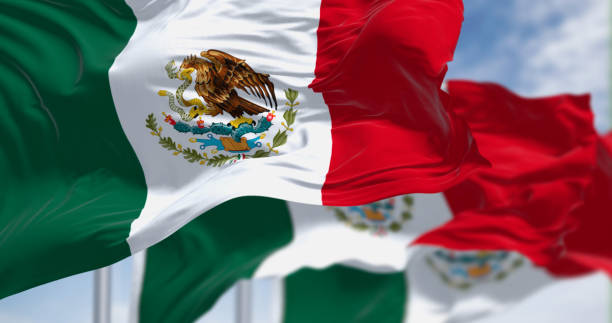 istock Three Mexican national flags waving in the wind 1490660922