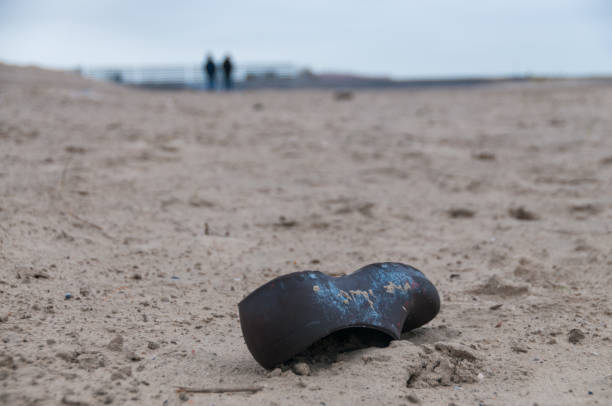 istock Lost shoe on the Beach 1490662254