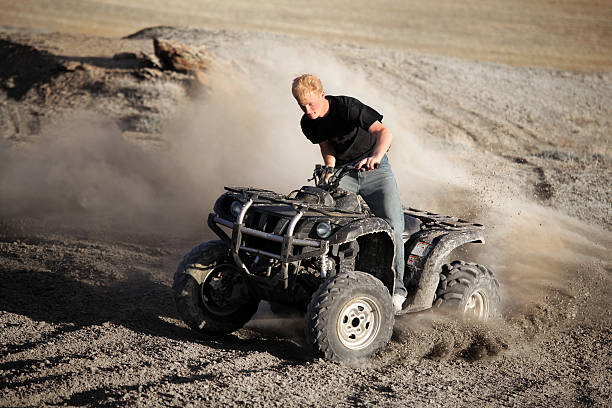 istock teenager riding quad - four wheeler 149066229