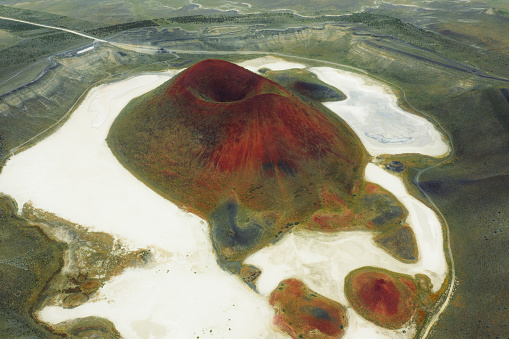 Drone photo of beautiful colorful volcano with crater surrounded by salt lake at Meke, Turkey, Middle East